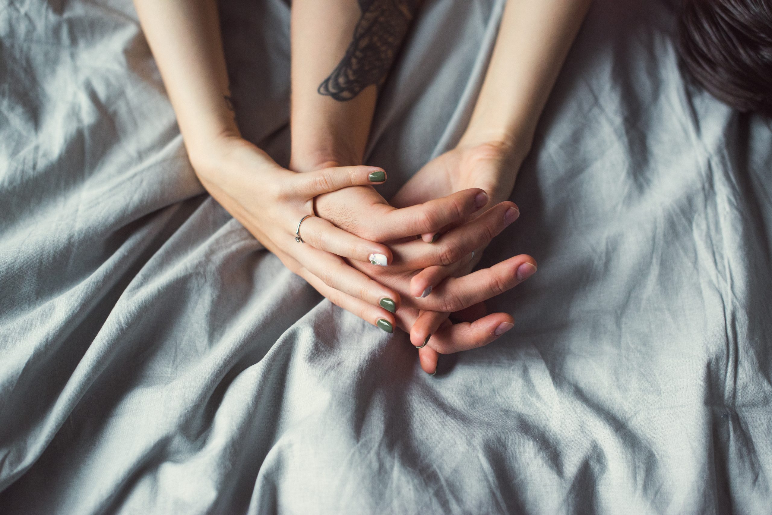 Close,Up,Shot,Of,Woman,And,Man's,Hands,With,Tattoos