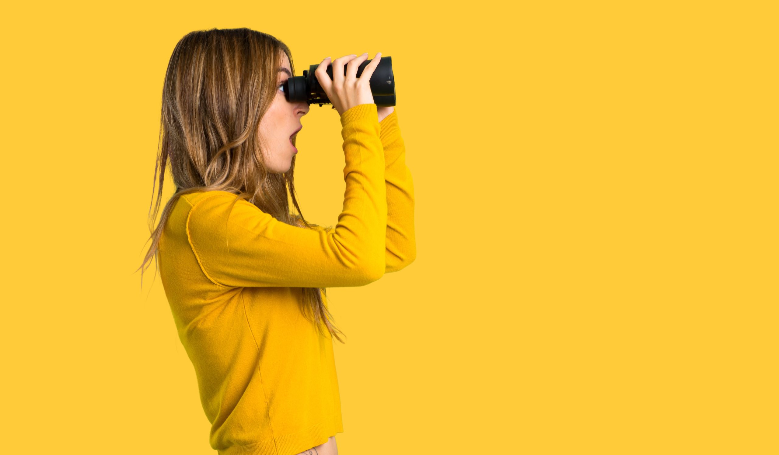 Young,Girl,With,Yellow,Sweater,And,Looking,In,The,Distance