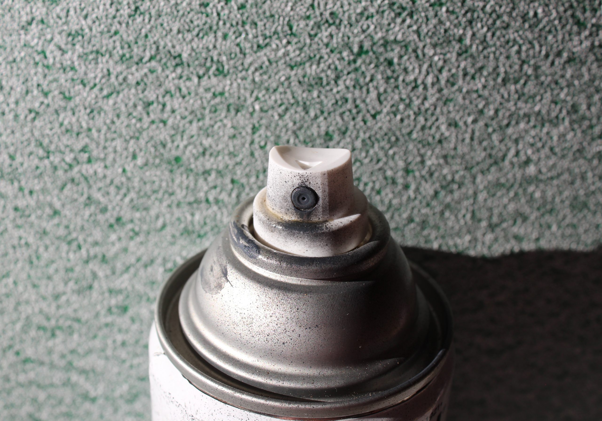 Close,Up,Of,Spray,Paint,Can,Nozzle.