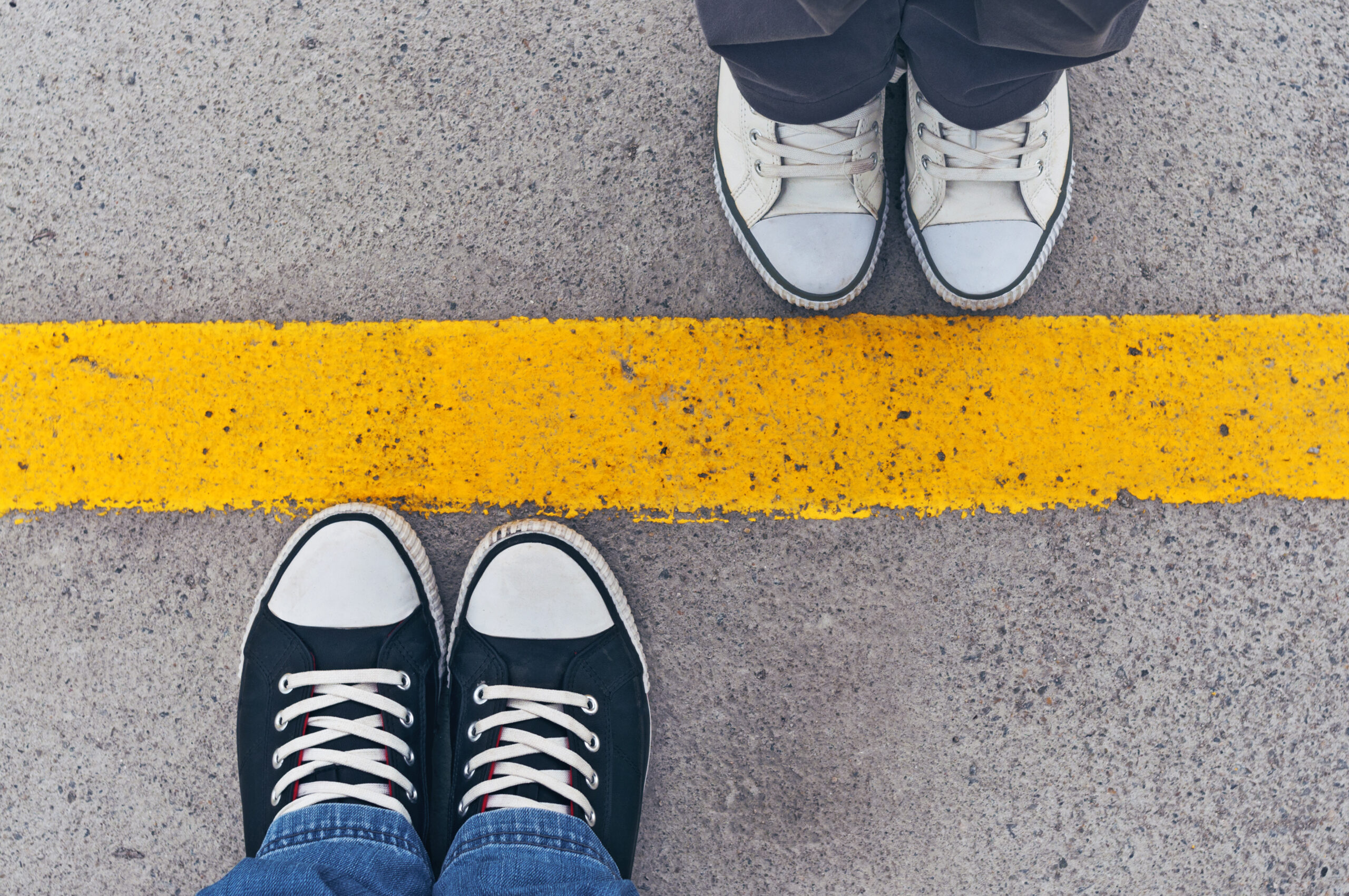 Top,View,Of,Sneakers,From,Above,,Male,And,Female,Feet