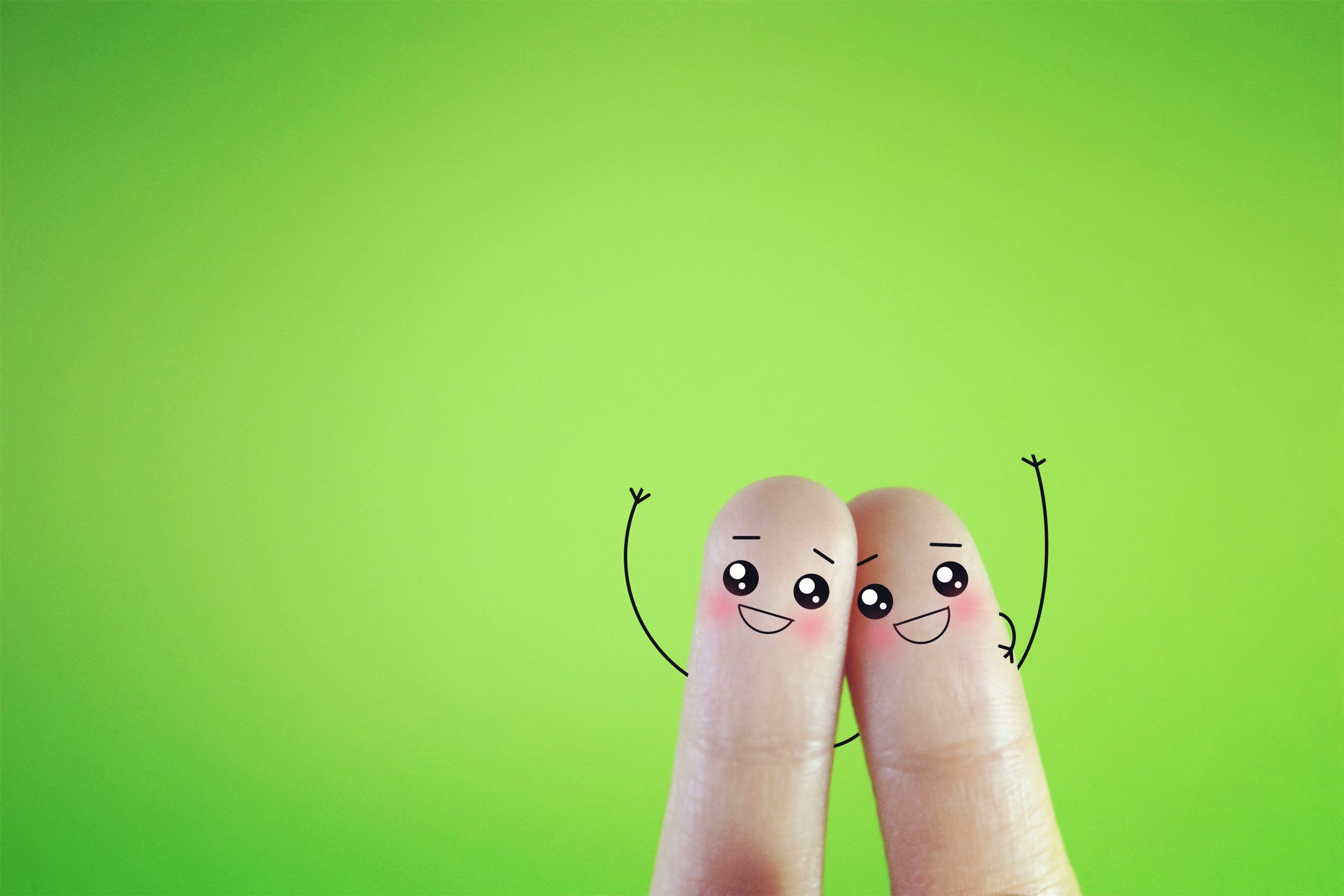 Two,Fingers,Decorated,As,Two,Happy,Friends,On,Green,Background.