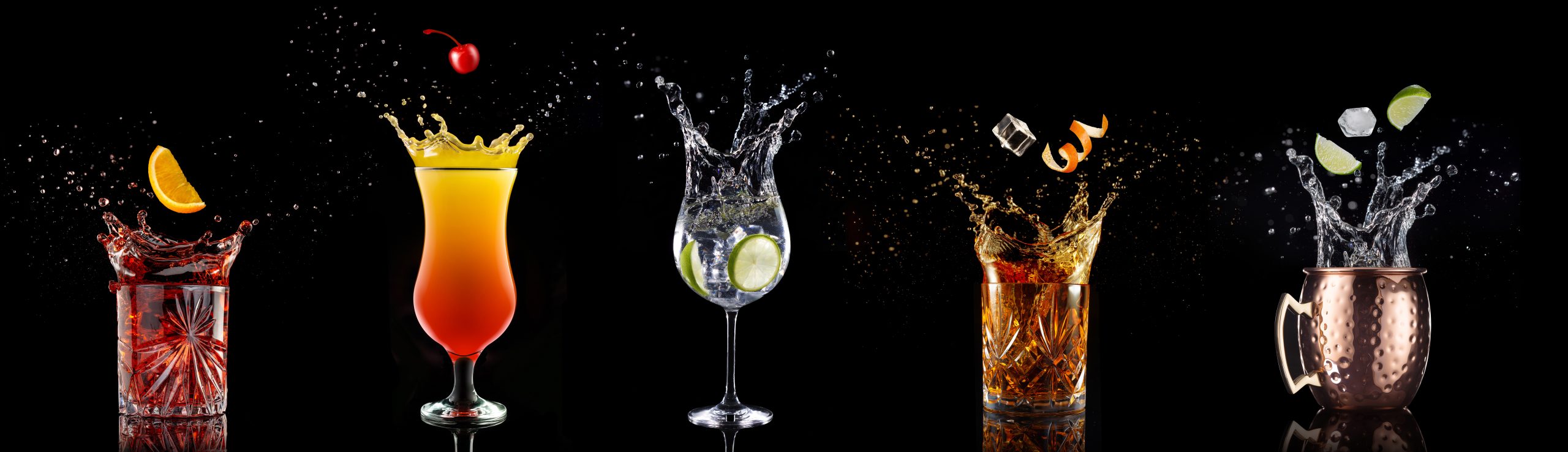 Fruit,Falling,Into,A,Collection,Of,Splashing,Cocktails,Isolated,On